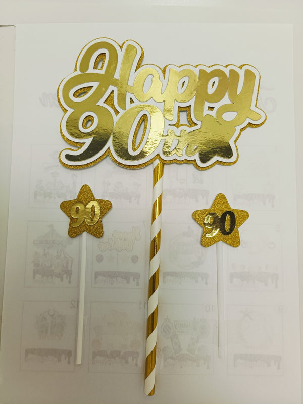 Gouden Happy leeftijdstaarttopper met twee kleine sterren, voorbeeld 90 jaar